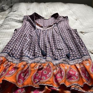 Sleeveless silky top with tassels size S